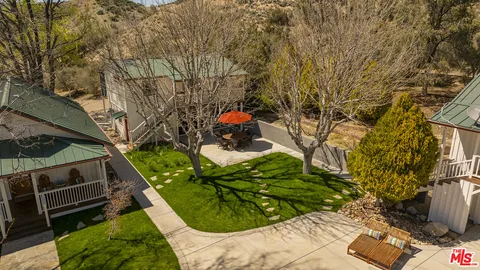 a view of swimming pool and trees in the background