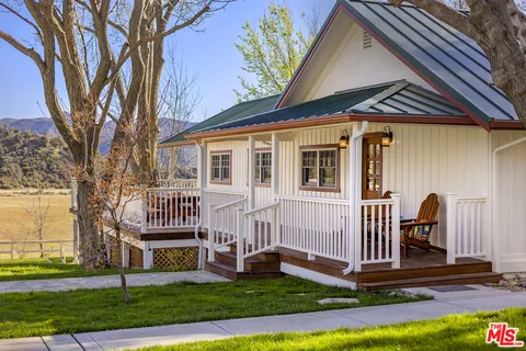 a view of a lake with a yard and mountain view