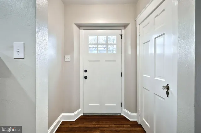 a view of room with window and hardwood floor