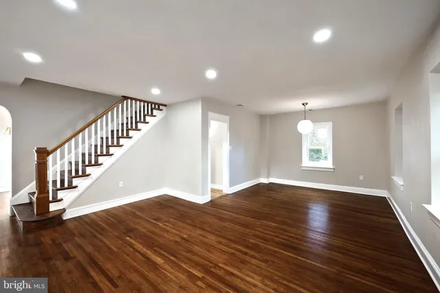 a view of an entryway with wooden floor