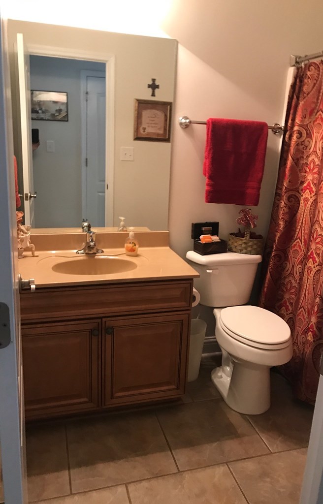 100 Timber Ridge Circle Byron, GA 31008 - Photo 13 of 35 a bathroom with a toilet sink and mirror