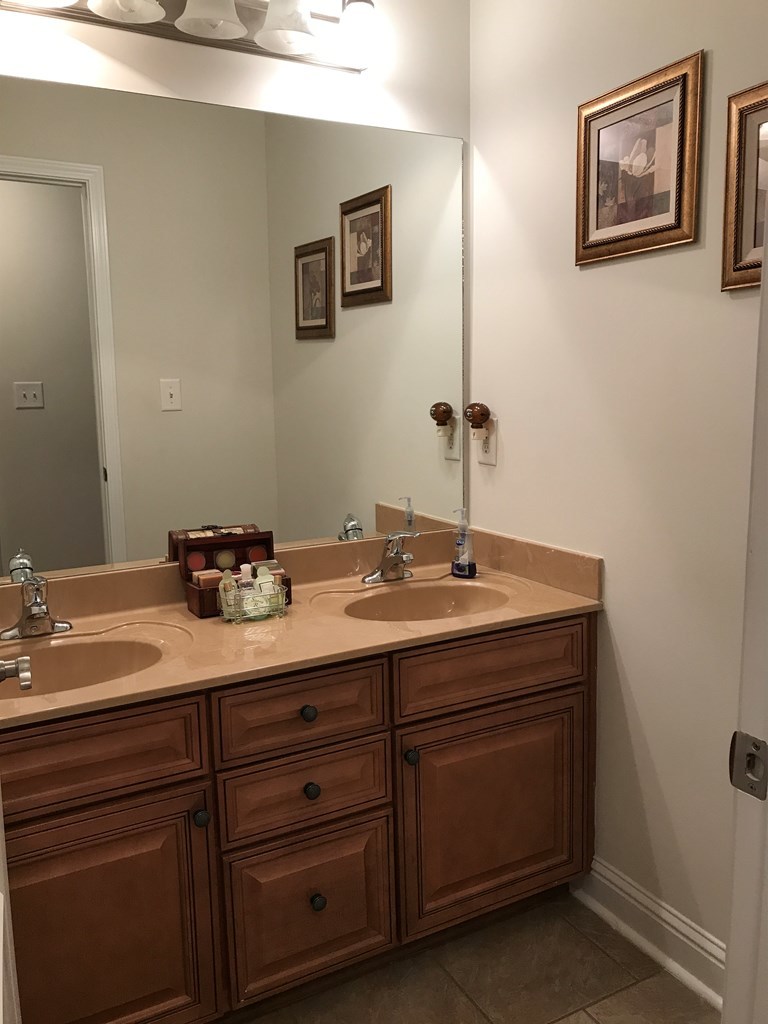 100 Timber Ridge Circle Byron, GA 31008 - Photo 14 of 35 a bathroom with a sink and a mirror