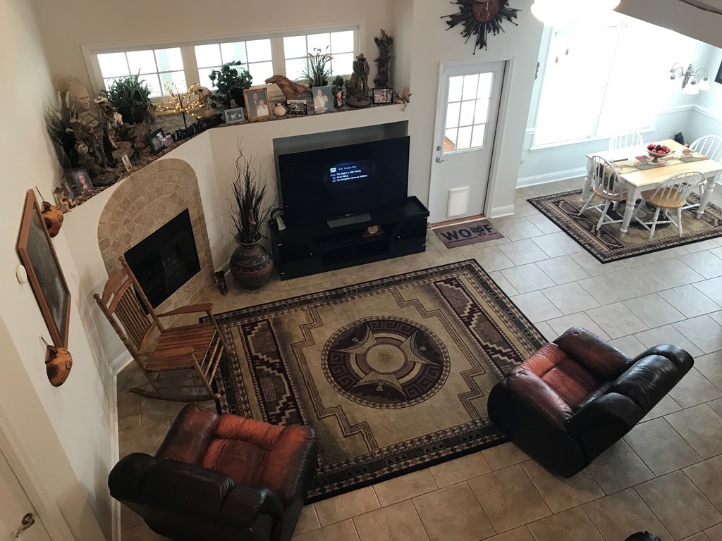 100 Timber Ridge Circle Byron, GA 31008 - Photo 3 of 35 a living room with furniture and a fireplace
