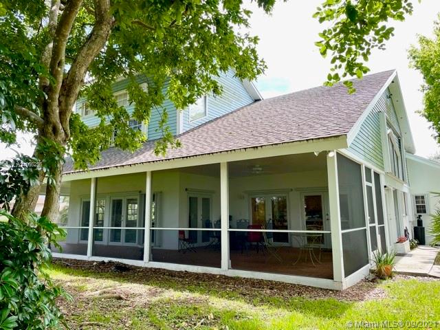 16721 Southwest 278th Street Homestead, FL 33031 - Photo 11 of 20 a view of a house with a large window and yard