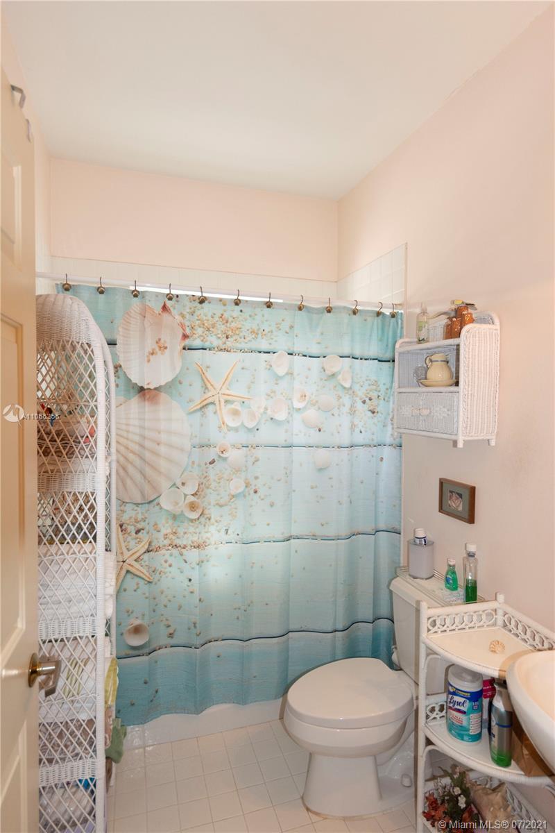16721 Southwest 278th Street Homestead, FL 33031 - Photo 7 of 20 a bathroom with a toilet and a shower