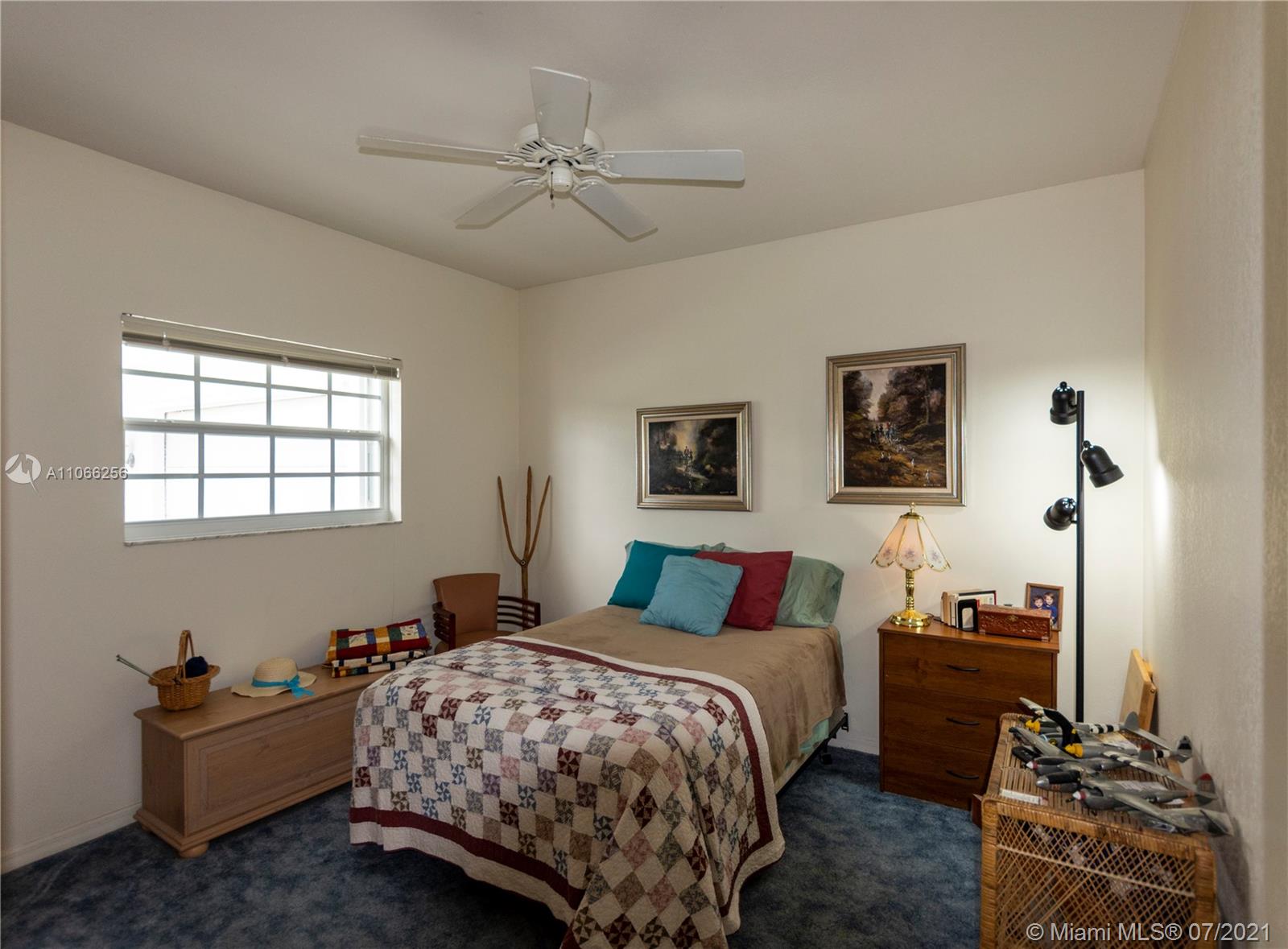 16721 Southwest 278th Street Homestead, FL 33031 - Photo 8 of 20 a bedroom with a bed and wooden floor