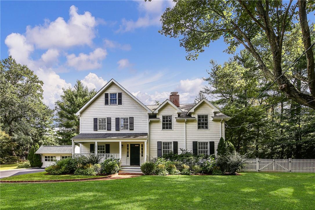 345 West Street Harrison, NY 10528 - Photo 1 of 1 a front view of house with yard and green space