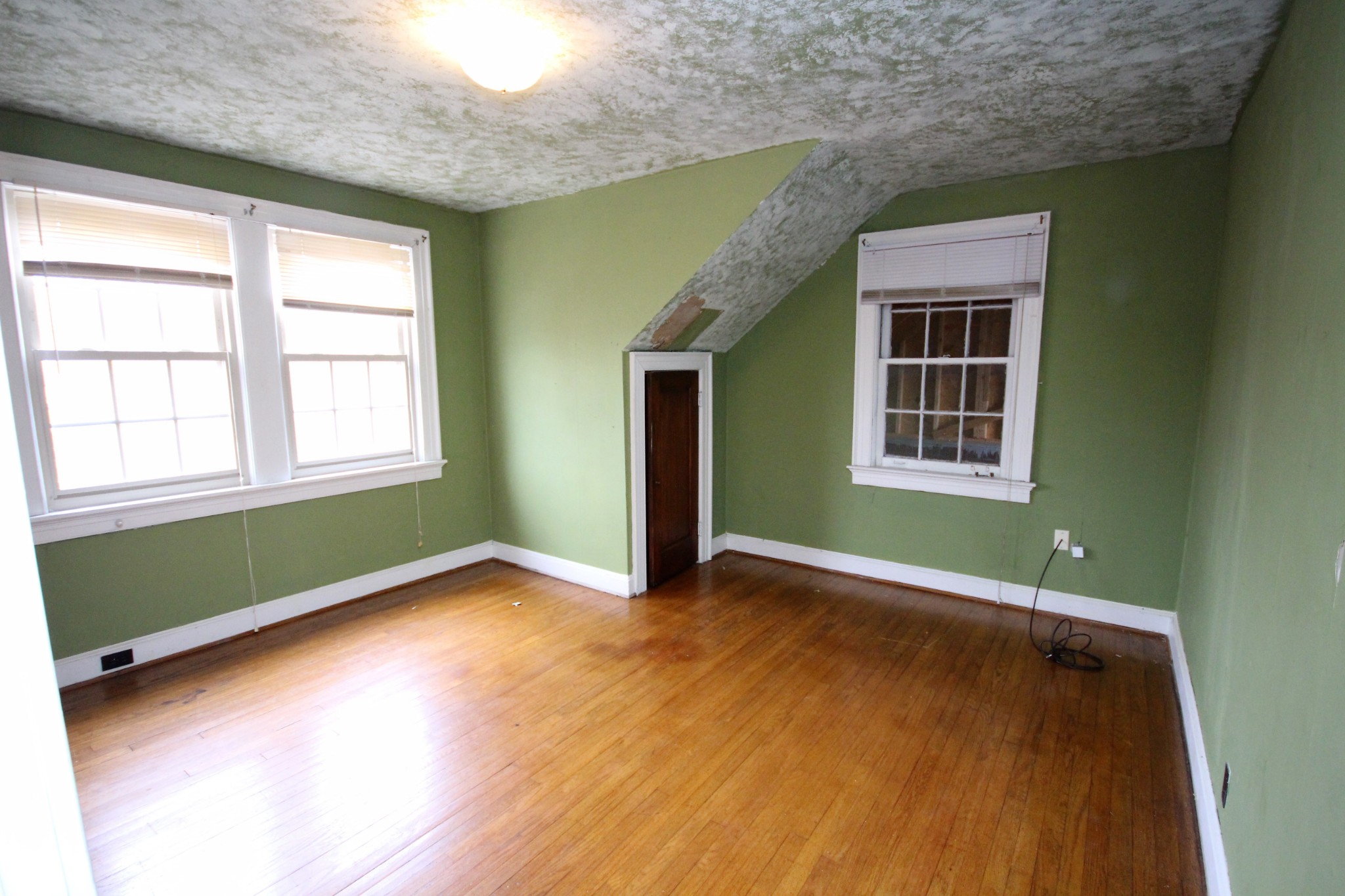 310 North Garner Street Springfield, TN 37172 - Photo 19 of 22 an empty room with wooden floor and windows