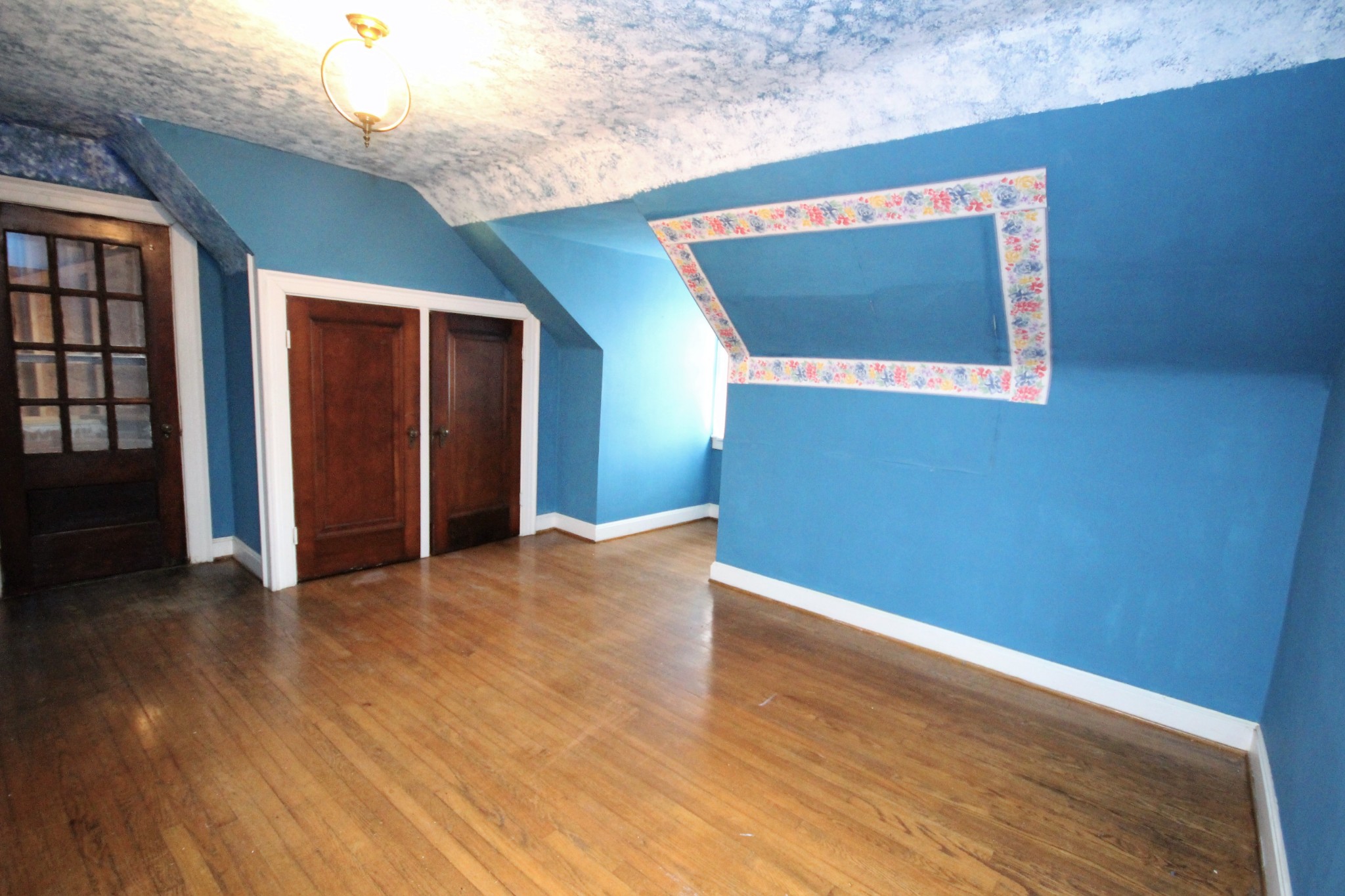 310 North Garner Street Springfield, TN 37172 - Photo 20 of 22 a view of an empty room with wooden floor and a hallway