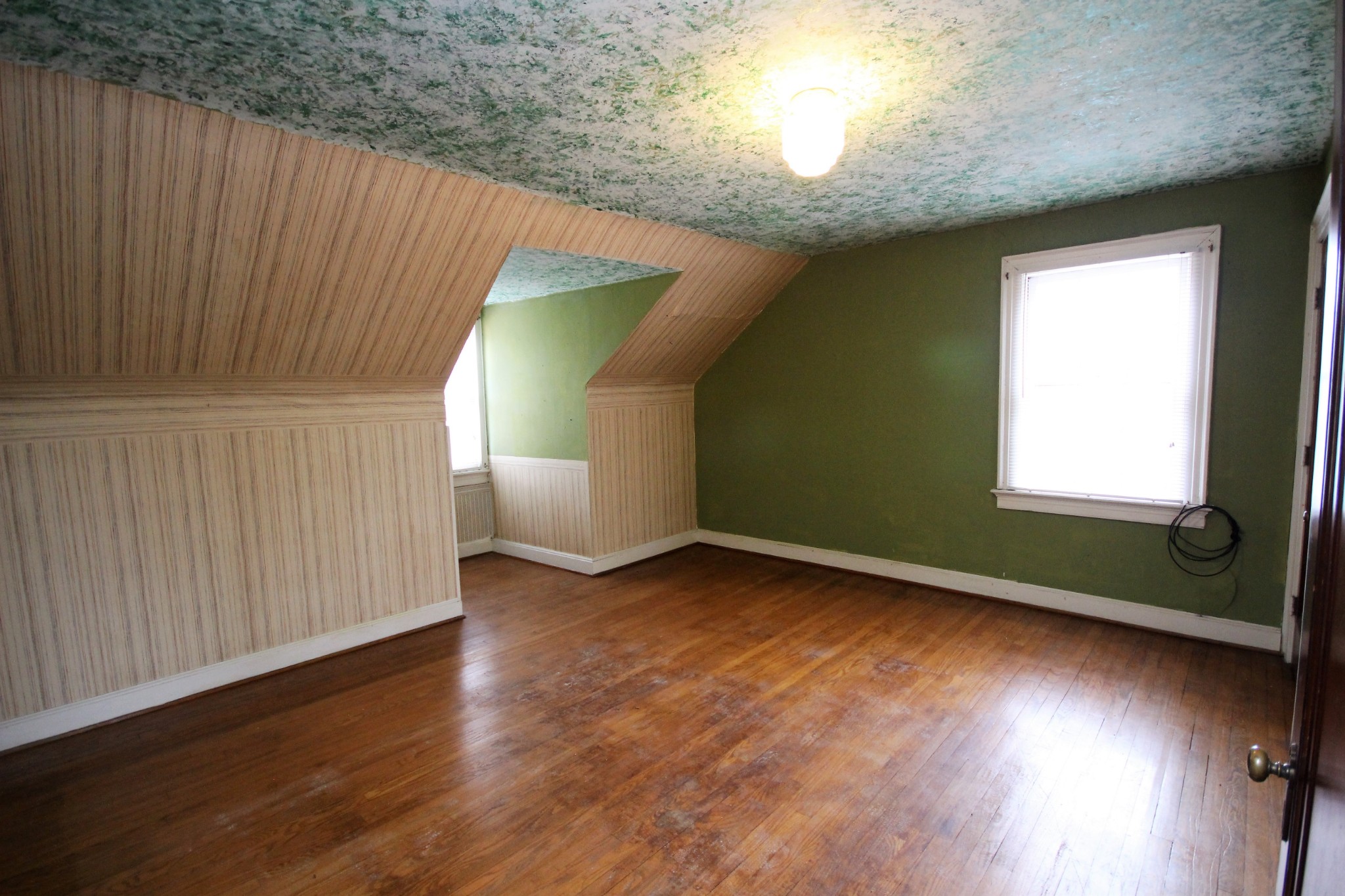 310 North Garner Street Springfield, TN 37172 - Photo 21 of 22 an empty room with wooden floor and windows