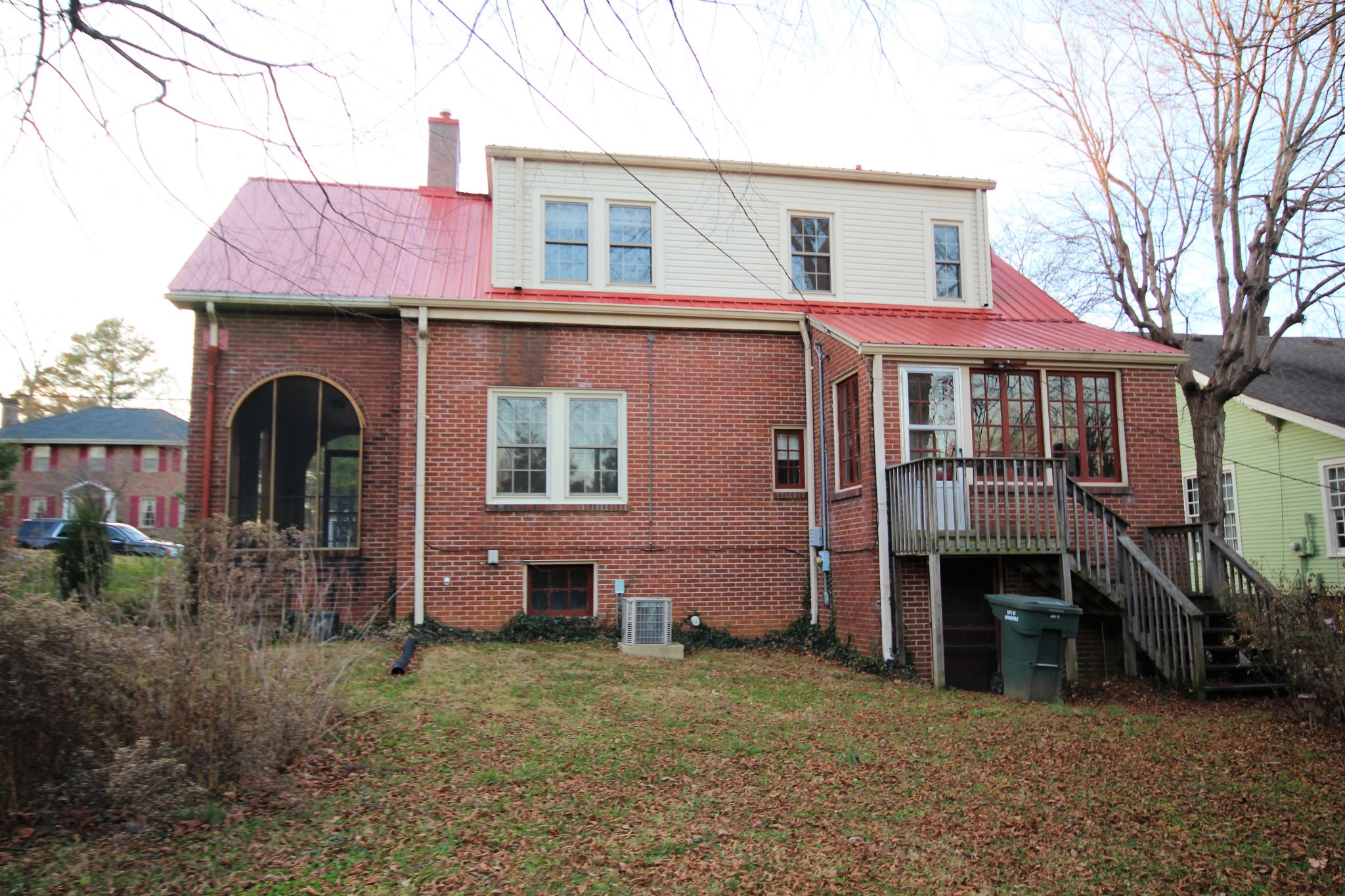 310 North Garner Street Springfield, TN 37172 - Photo 5 of 22 a view of brick house with large windows and a small yard