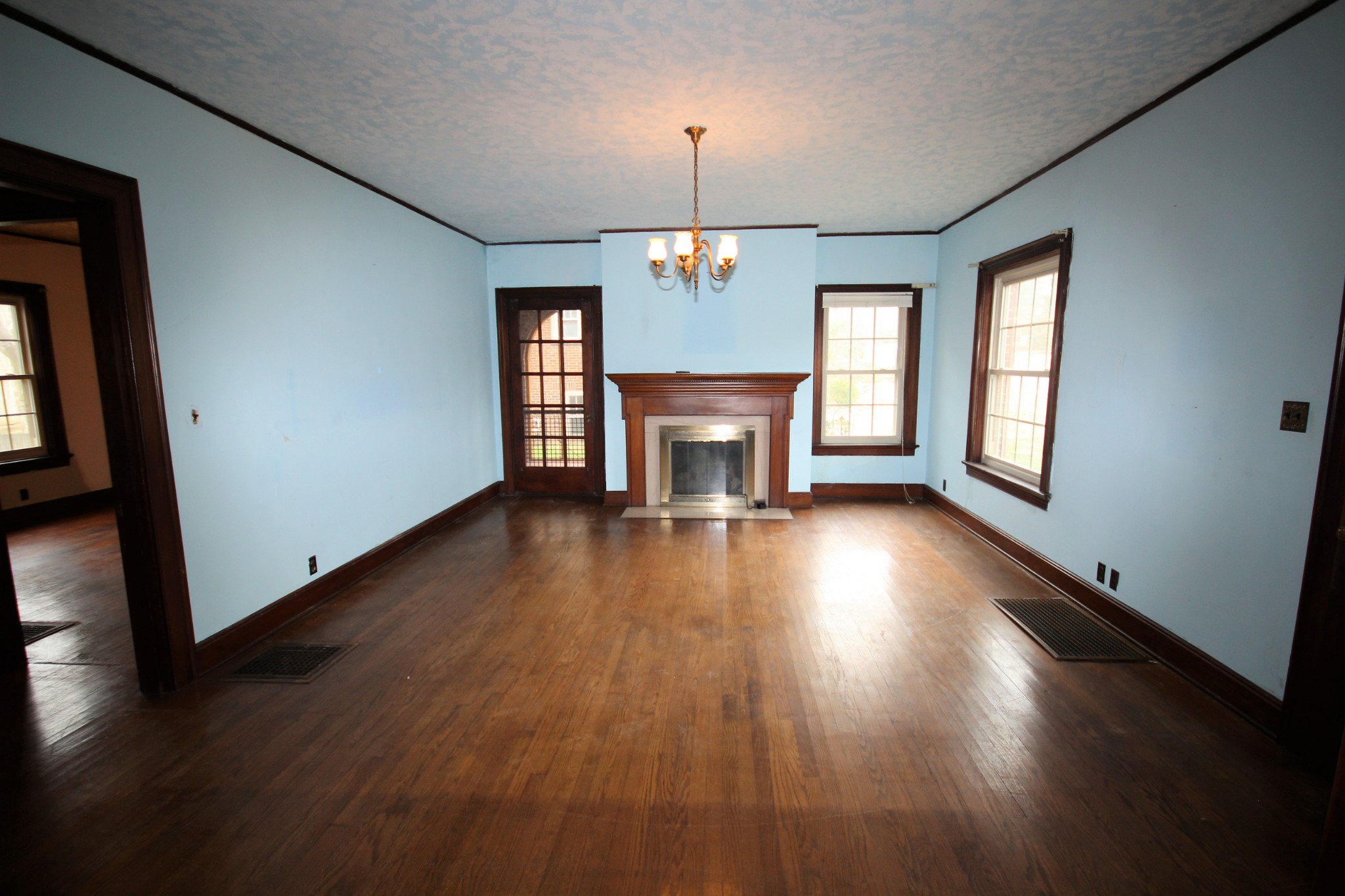 310 North Garner Street Springfield, TN 37172 - Photo 6 of 22 an empty room with wooden floor and windows