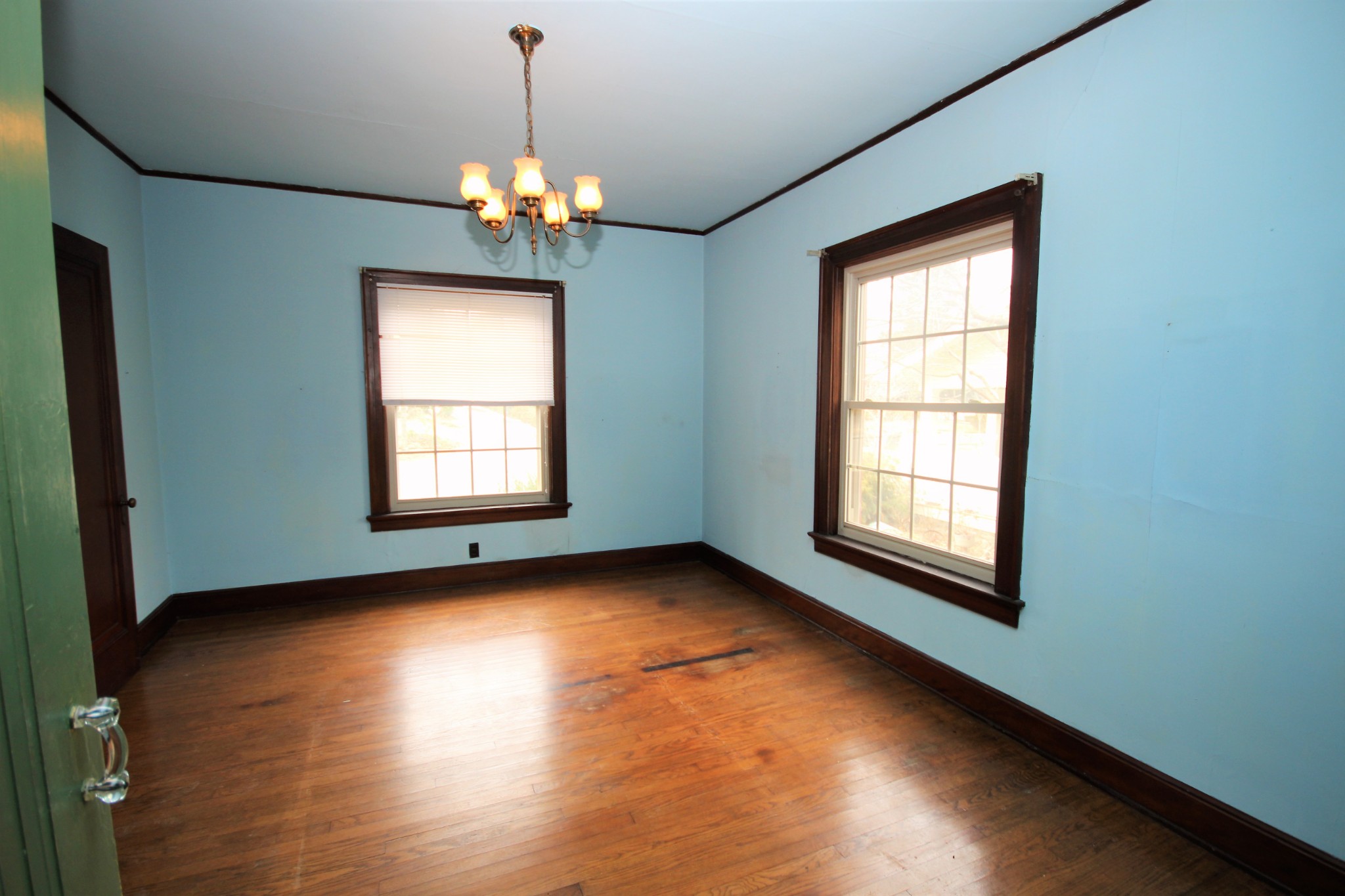 310 North Garner Street Springfield, TN 37172 - Photo 10 of 22 a view of an empty room with wooden floor and a window