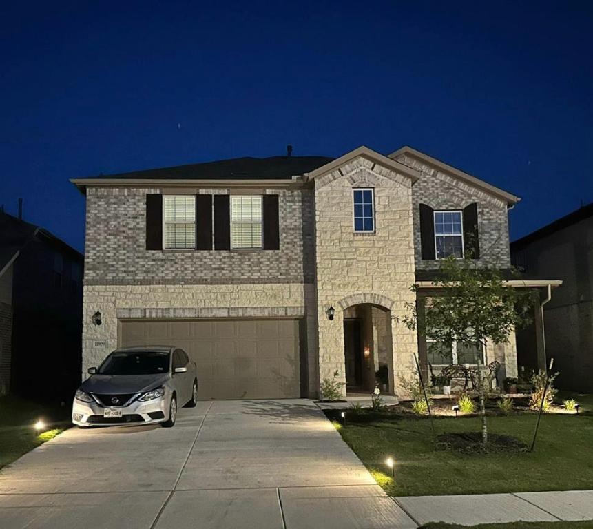 a front view of a house with parking space