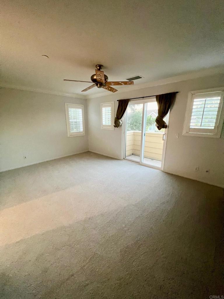 51 Palladium Lane Ladera Ranch, CA 92694 - Photo 17 of 24 an empty room with windows and ceiling fan