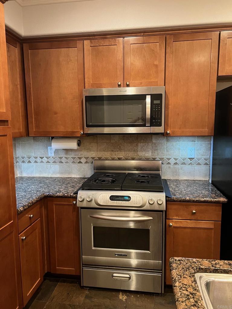 51 Palladium Lane Ladera Ranch, CA 92694 - Photo 22 of 24 a kitchen with granite countertop cabinets stainless steel appliances and a counter space