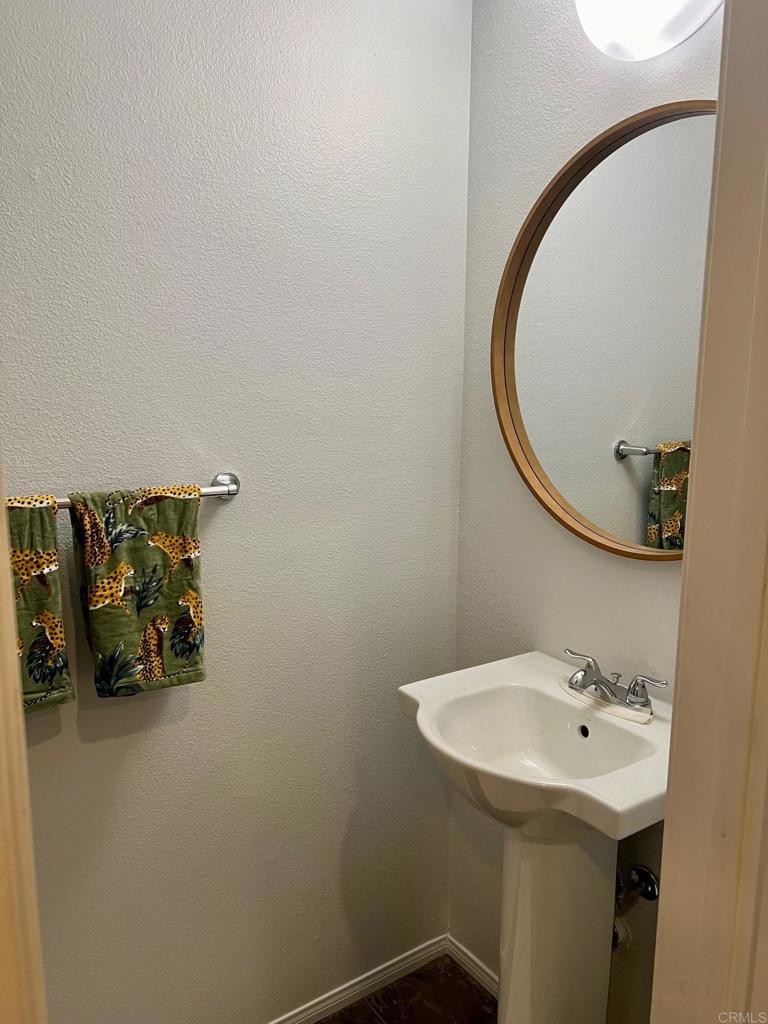 51 Palladium Lane Ladera Ranch, CA 92694 - Photo 7 of 24 a bathroom with a sink and mirror