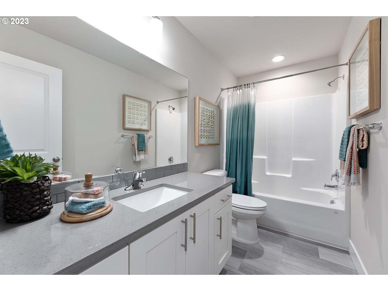 302 North 89th Loop Ridgefield, WA 98642 - Photo 16 of 29 a bathroom with a sink a toilet and shower