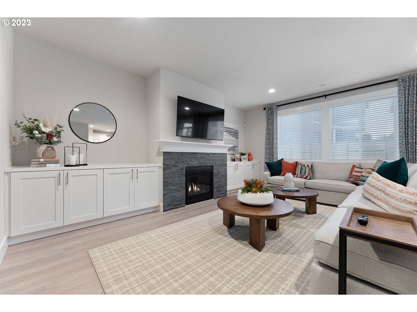302 North 89th Loop Ridgefield, WA 98642 - Photo 2 of 29 a living room with furniture and a fireplace