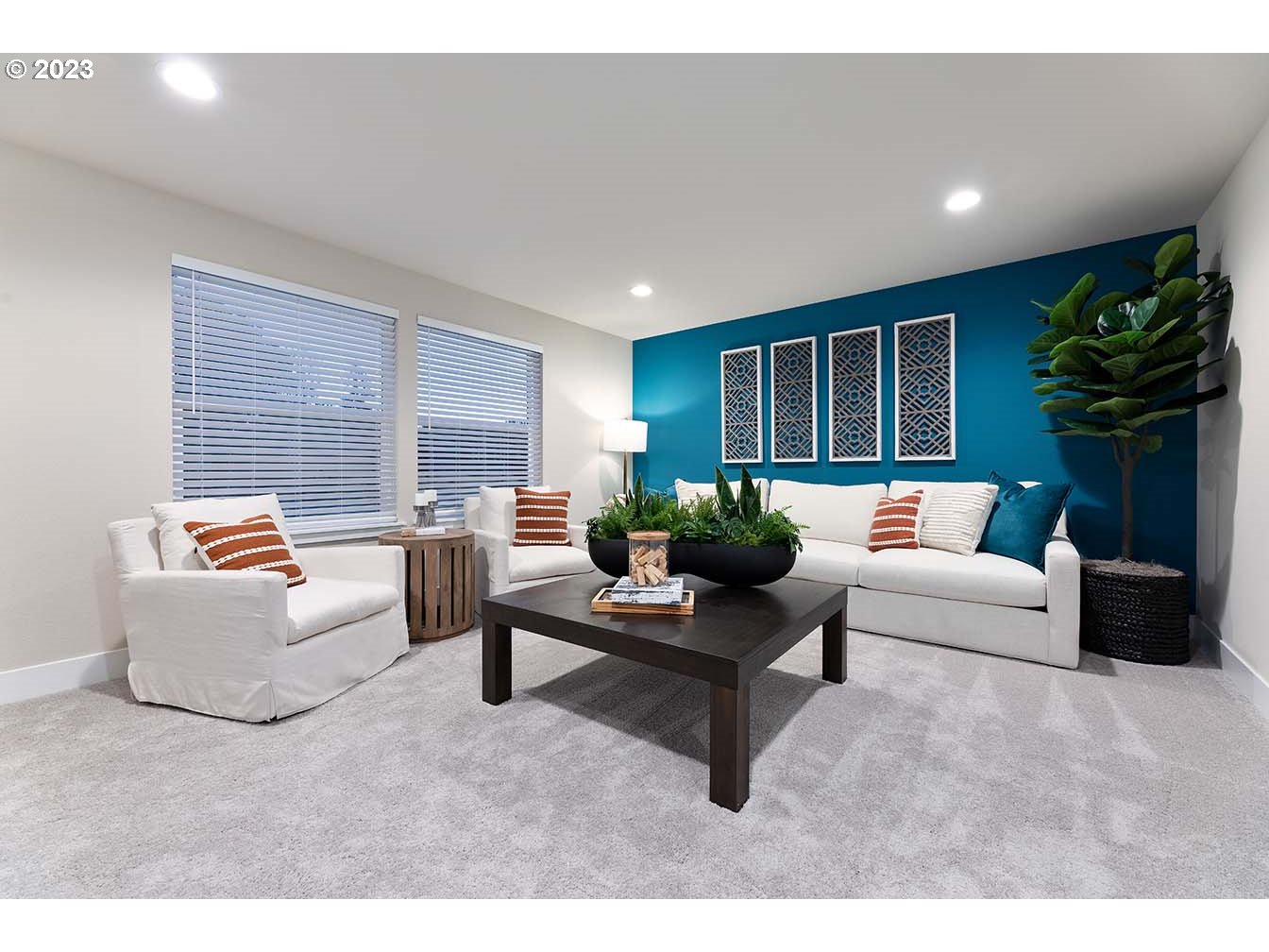 302 North 89th Loop Ridgefield, WA 98642 - Photo 21 of 29 a living room with furniture and a potted plant