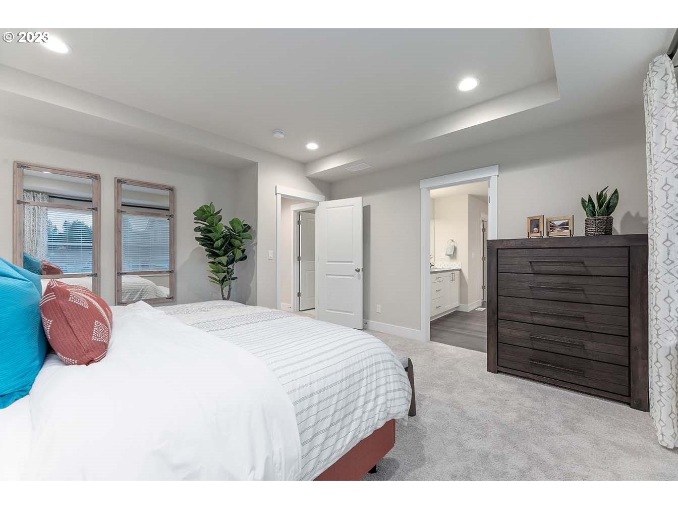 302 North 89th Loop Ridgefield, WA 98642 - Photo 10 of 29 a bedroom with a bed and a dresser