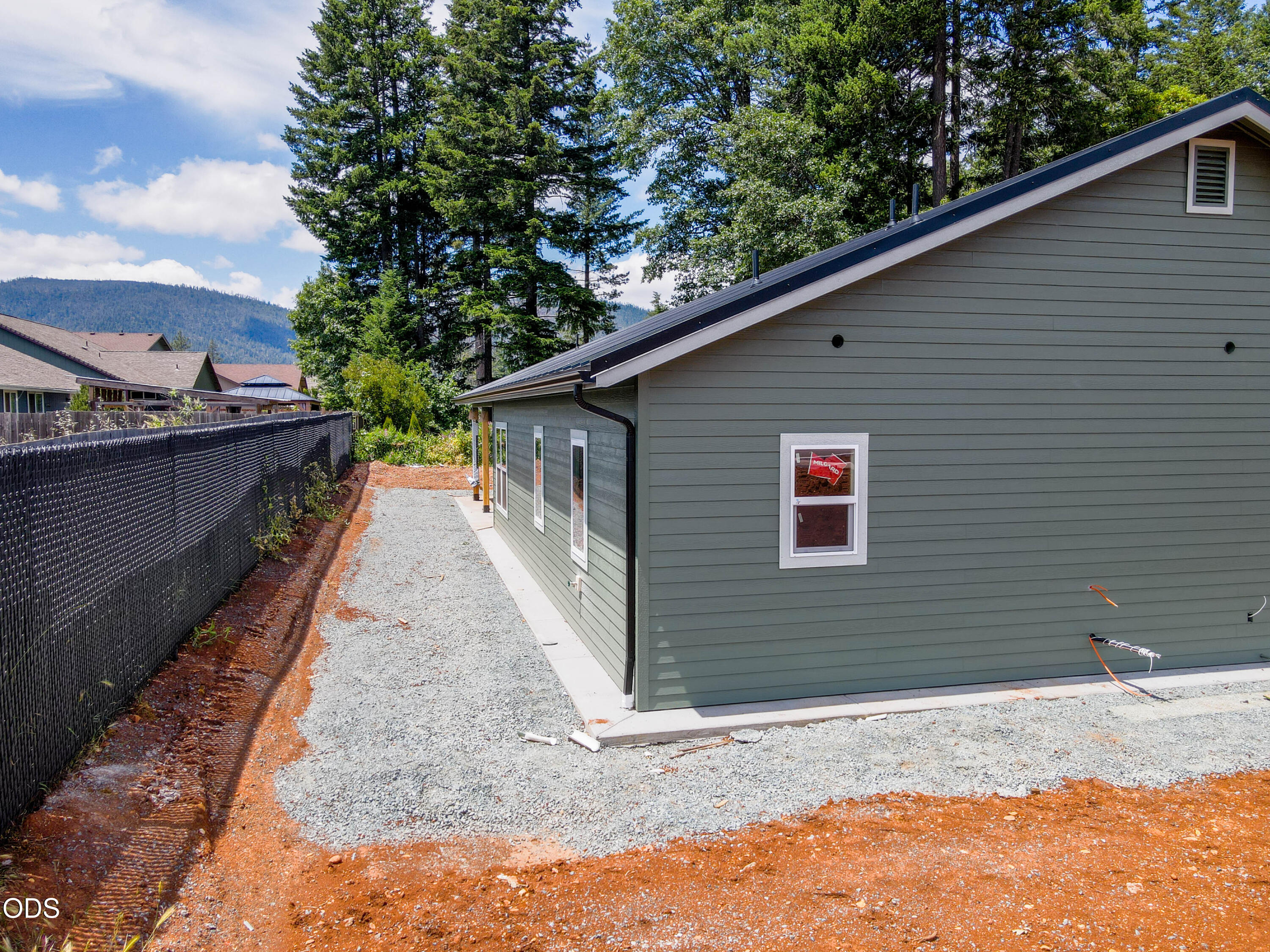 405 Cece Lane Cave Junction, OR 97523 - Photo 7 of 15 a backyard of a house with lots of green space