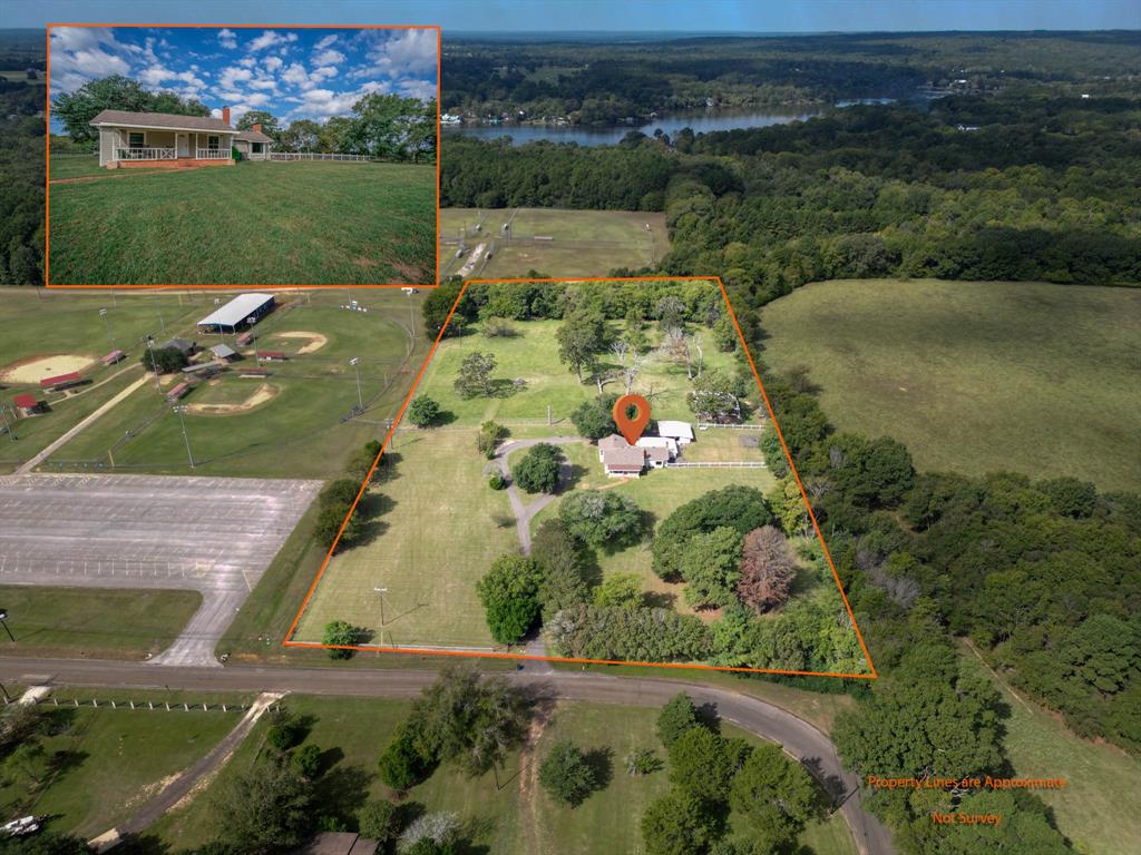 an aerial view of a house with a yard