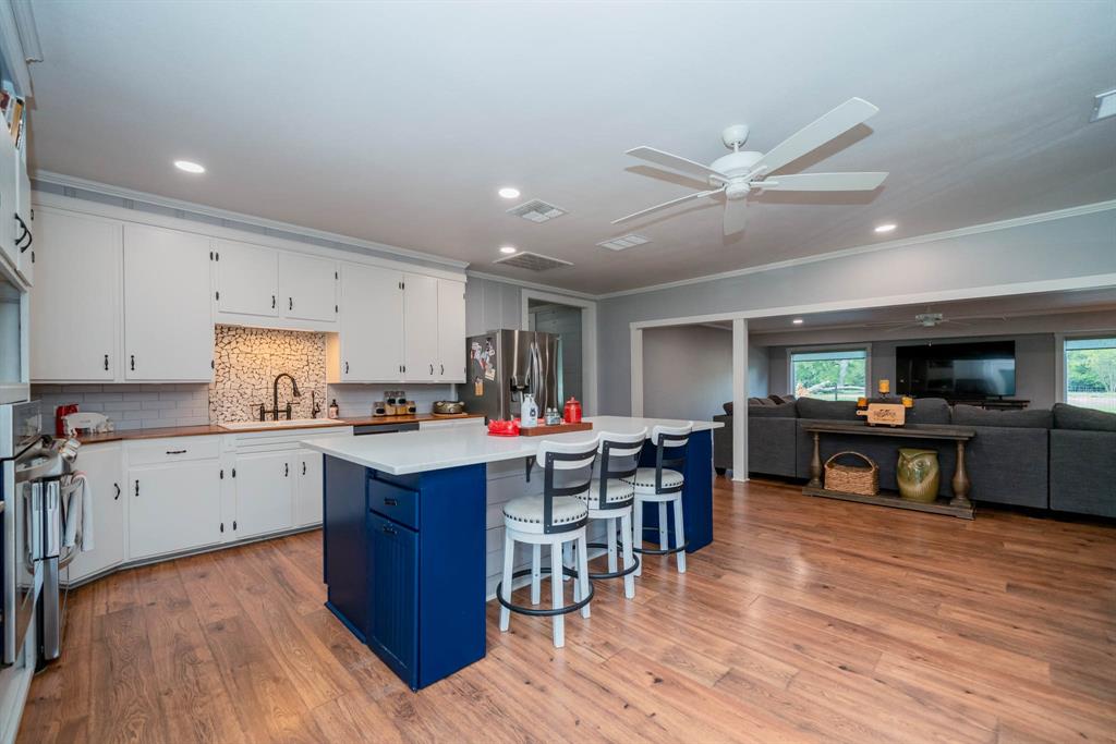 1901 Byrd Road Jacksonville, TX 75766 - Photo 11 of 40 a open kitchen with cabinets stove and center island