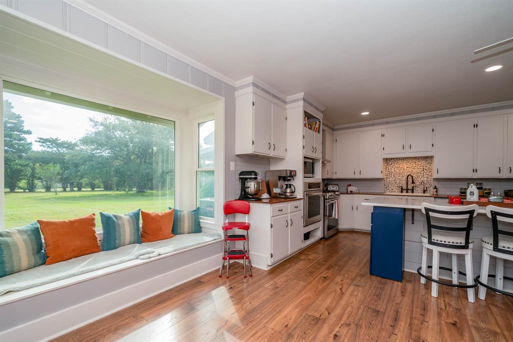 1901 Byrd Road Jacksonville, TX 75766 - Photo 12 of 40 a kitchen with furniture a counter top space and a view of living room
