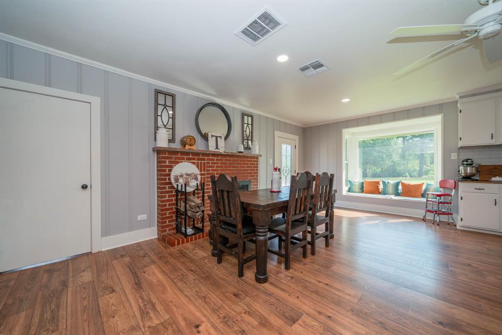 1901 Byrd Road Jacksonville, TX 75766 - Photo 13 of 40 a view of a dining room with furniture window and wooden floor