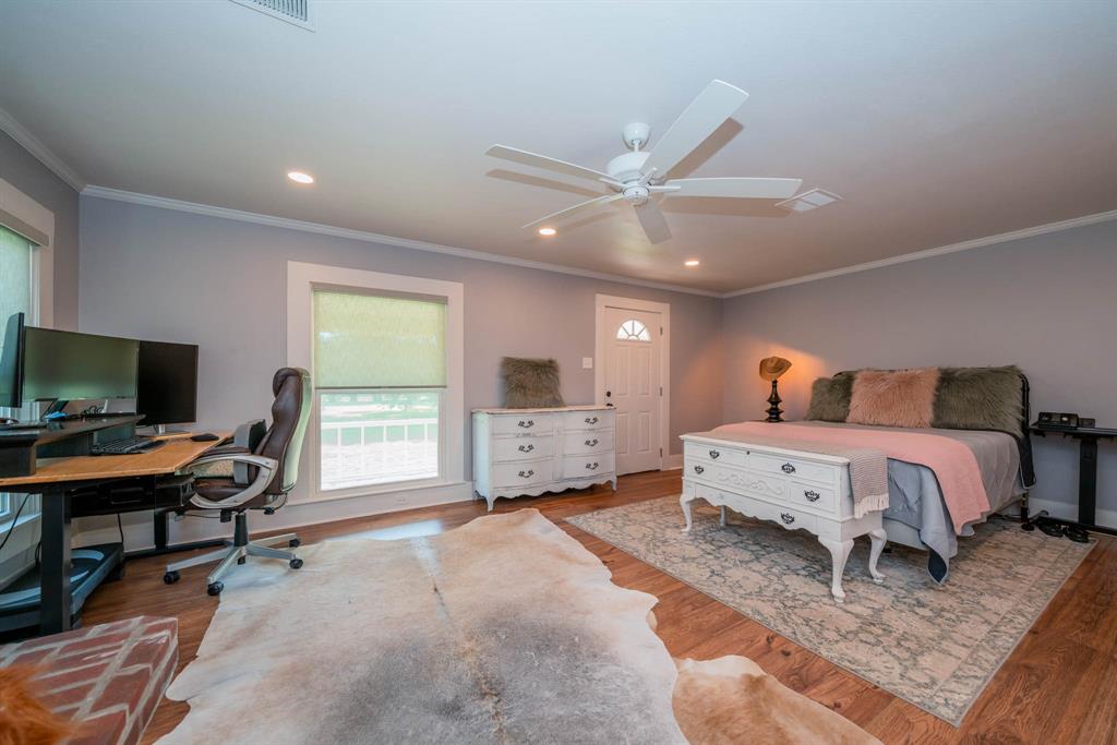 1901 Byrd Road Jacksonville, TX 75766 - Photo 17 of 40 a bedroom with a bed and a flat screen tv