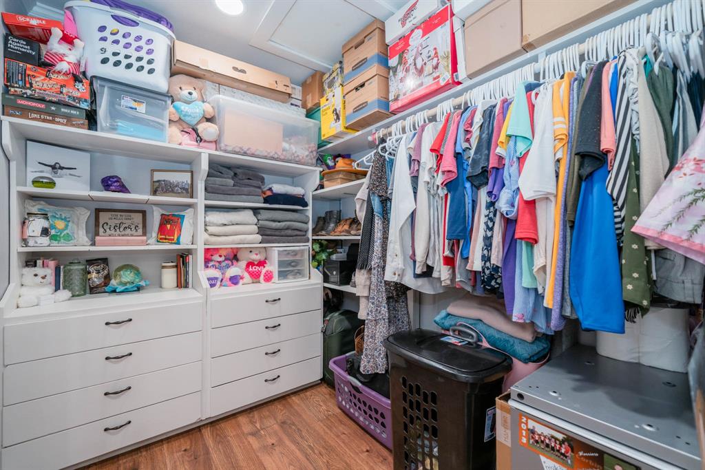 1901 Byrd Road Jacksonville, TX 75766 - Photo 22 of 40 a view of walk in closet with clothes and shoes