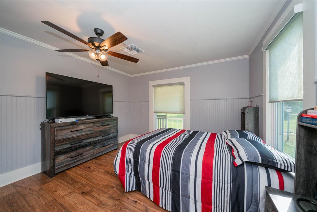 1901 Byrd Road Jacksonville, TX 75766 - Photo 28 of 40 a bedroom with a bed and a flat screen tv
