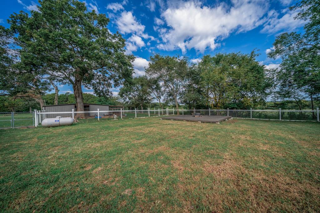 1901 Byrd Road Jacksonville, TX 75766 - Photo 32 of 40 Fenced backyard featuring view of scattered trees