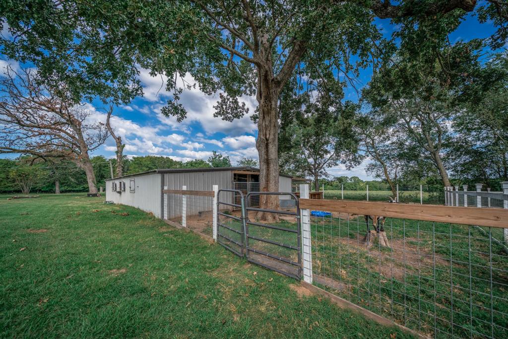 1901 Byrd Road Jacksonville, TX 75766 - Photo 35 of 40 a view of a backyard with a garden