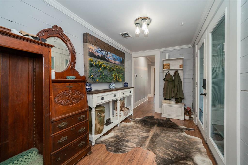 1901 Byrd Road Jacksonville, TX 75766 - Photo 7 of 40 Mudroom featuring wood finished floors and crown molding