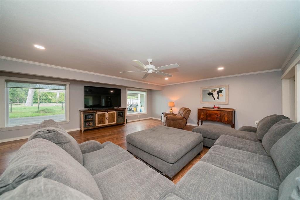 1901 Byrd Road Jacksonville, TX 75766 - Photo 8 of 40 a living room with furniture and a flat screen tv