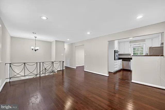 a view of a kitchen with a sink and a stove top oven
