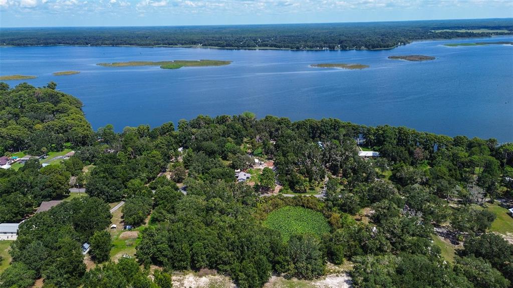 8601 West Bass Lake Road, Unit 12 Crystal River, FL 34428 - Photo 4 of 22 an aerial view of a houses with outdoor space and swimming pool