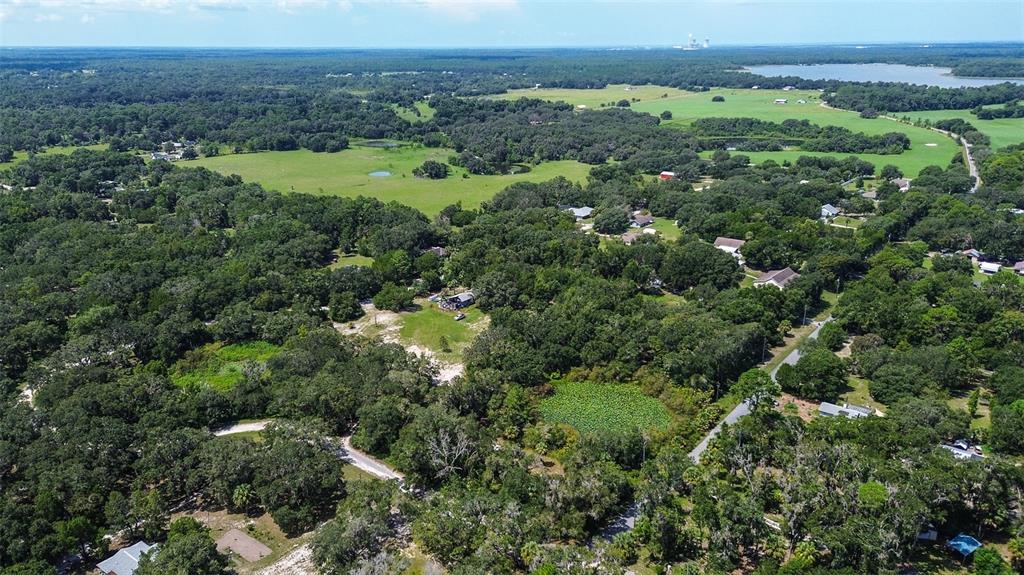 8601 West Bass Lake Road, Unit 12 Crystal River, FL 34428 - Photo 7 of 22 an aerial view of a residential houses with outdoor space and trees