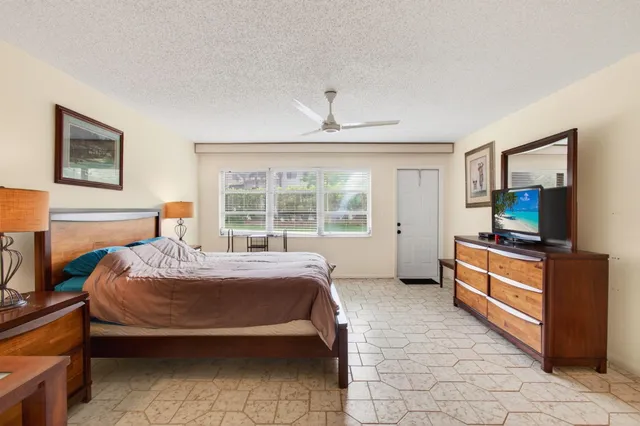 a bed room with a bed and a television