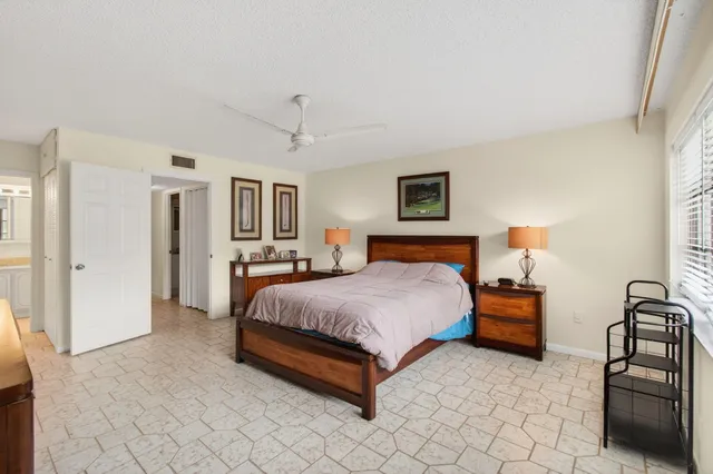a bedroom with bed and window