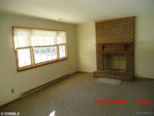 10620 Trents Bridge Road Chesterfield, VA 23838 - Photo 2 of 6 an empty room with a empty space and windows