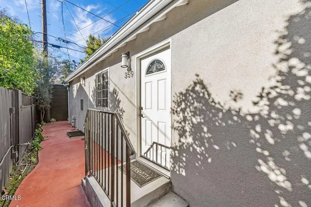 a view of a house with wooden stairs