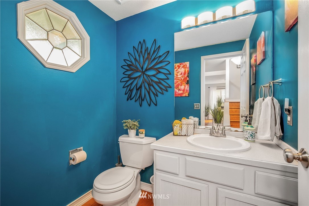 102 237th Place Southwest Bothell, WA 98021 - Photo 14 of 34 a bathroom with a toilet sink and mirror