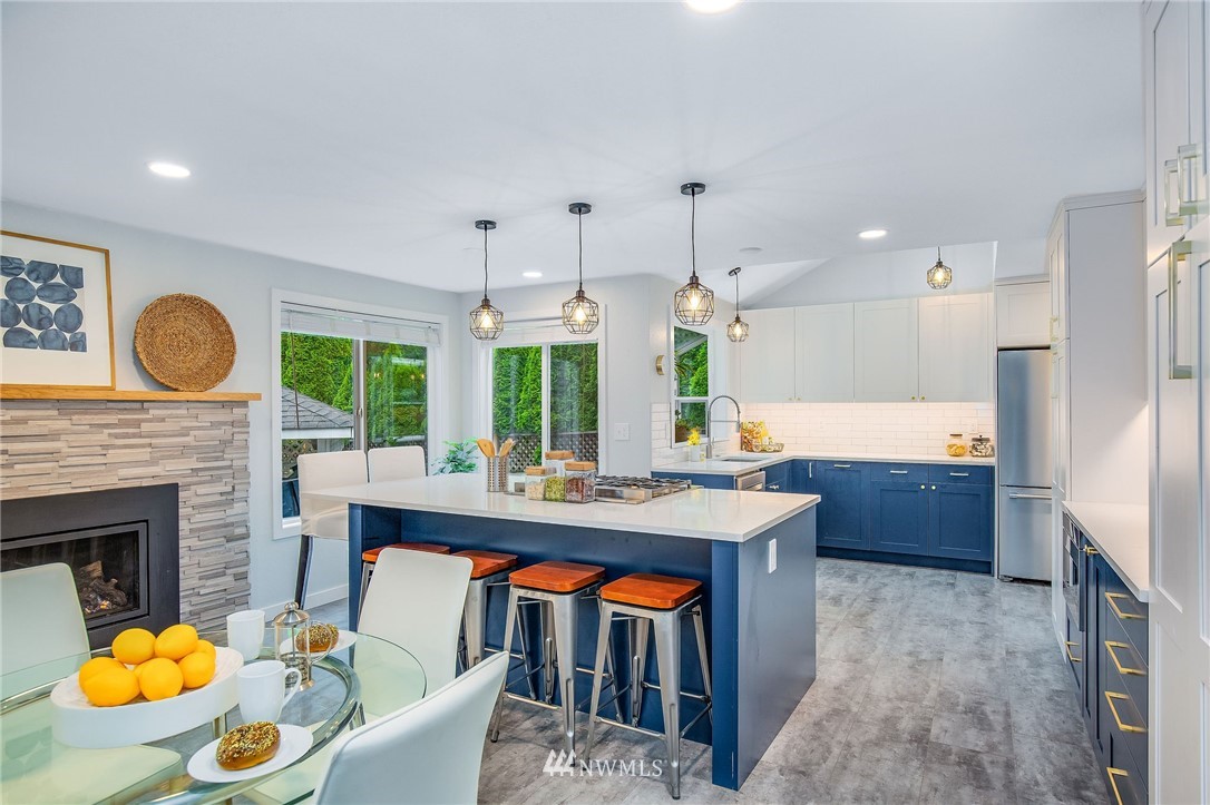 102 237th Place Southwest Bothell, WA 98021 - Photo 7 of 34 a large kitchen with a table and chairs