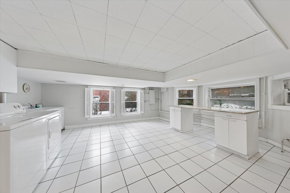 1235 Ridge Avenue Evanston, IL 60202 - Photo 27 of 36 a kitchen with stainless steel appliances a sink stove and cabinets