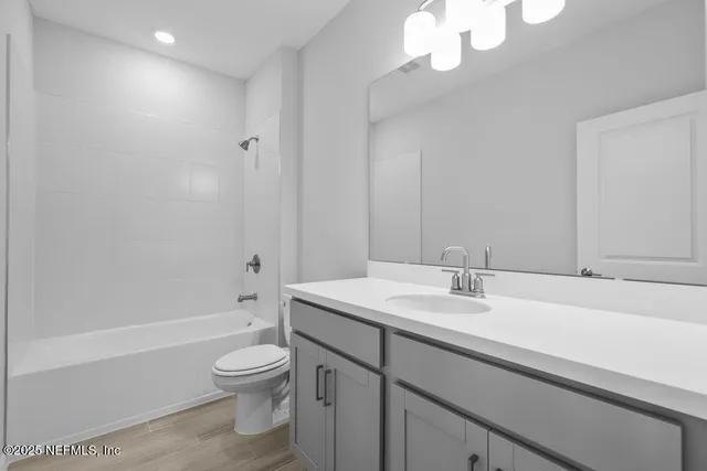 a bathroom with a sink a toilet and a bathtub