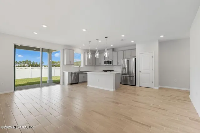 a view of kitchen with wooden floor