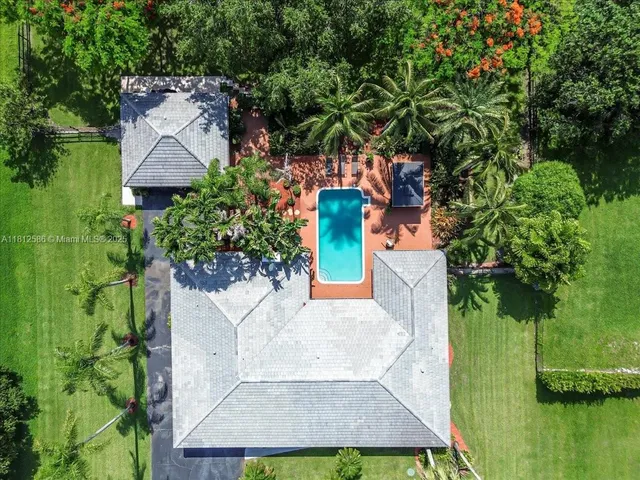 an aerial view of a house with a garden